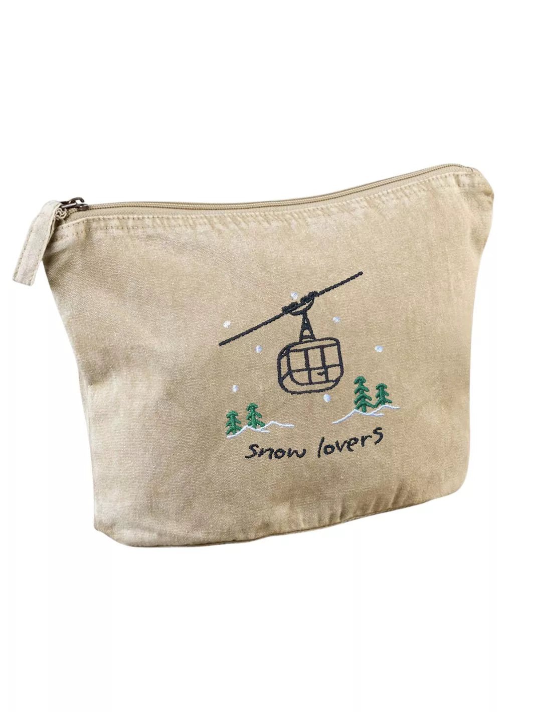 washed beige faded cotton travel pouch with embroidered cable car, pine trees, snow and Snow Lovers lettering