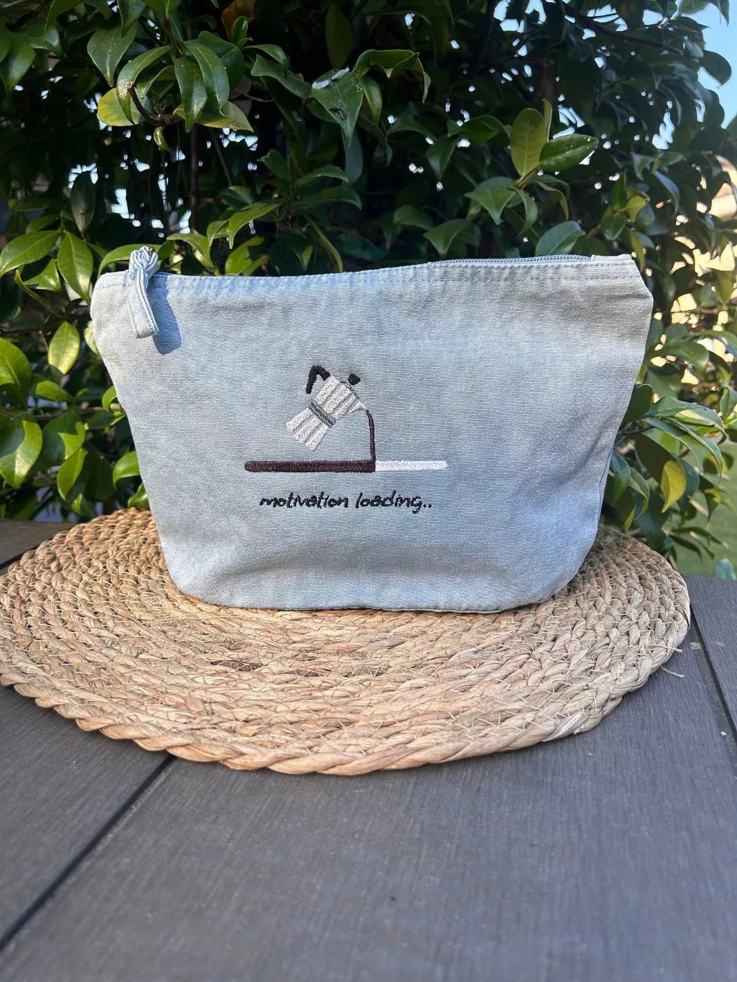 Motivation Loading recycled cotton pouch in washed sky