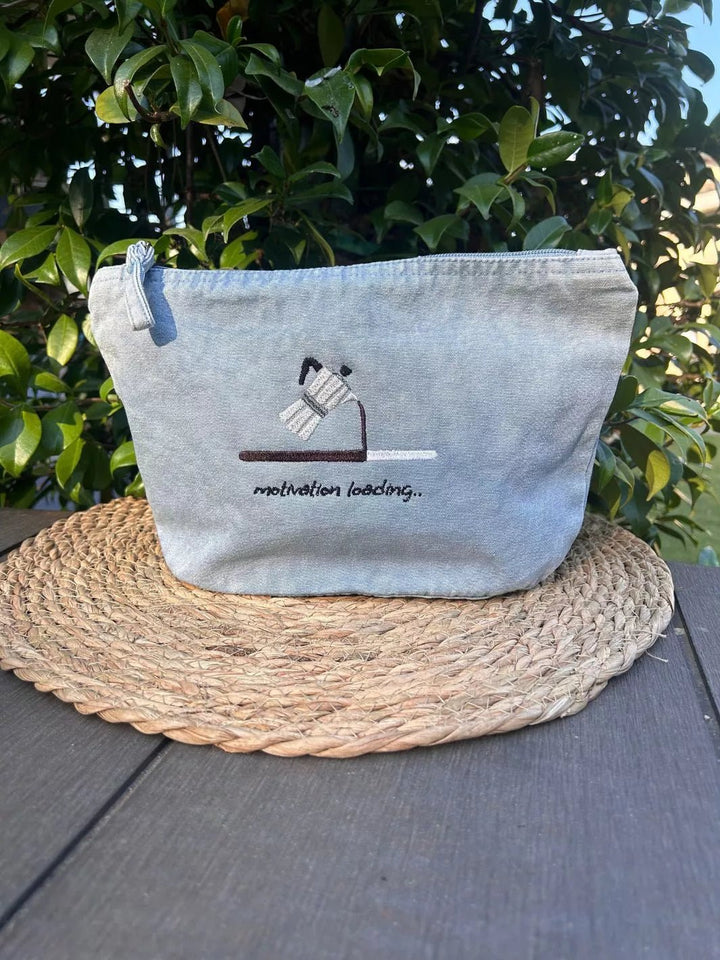 Motivation Loading recycled cotton pouch in washed sky