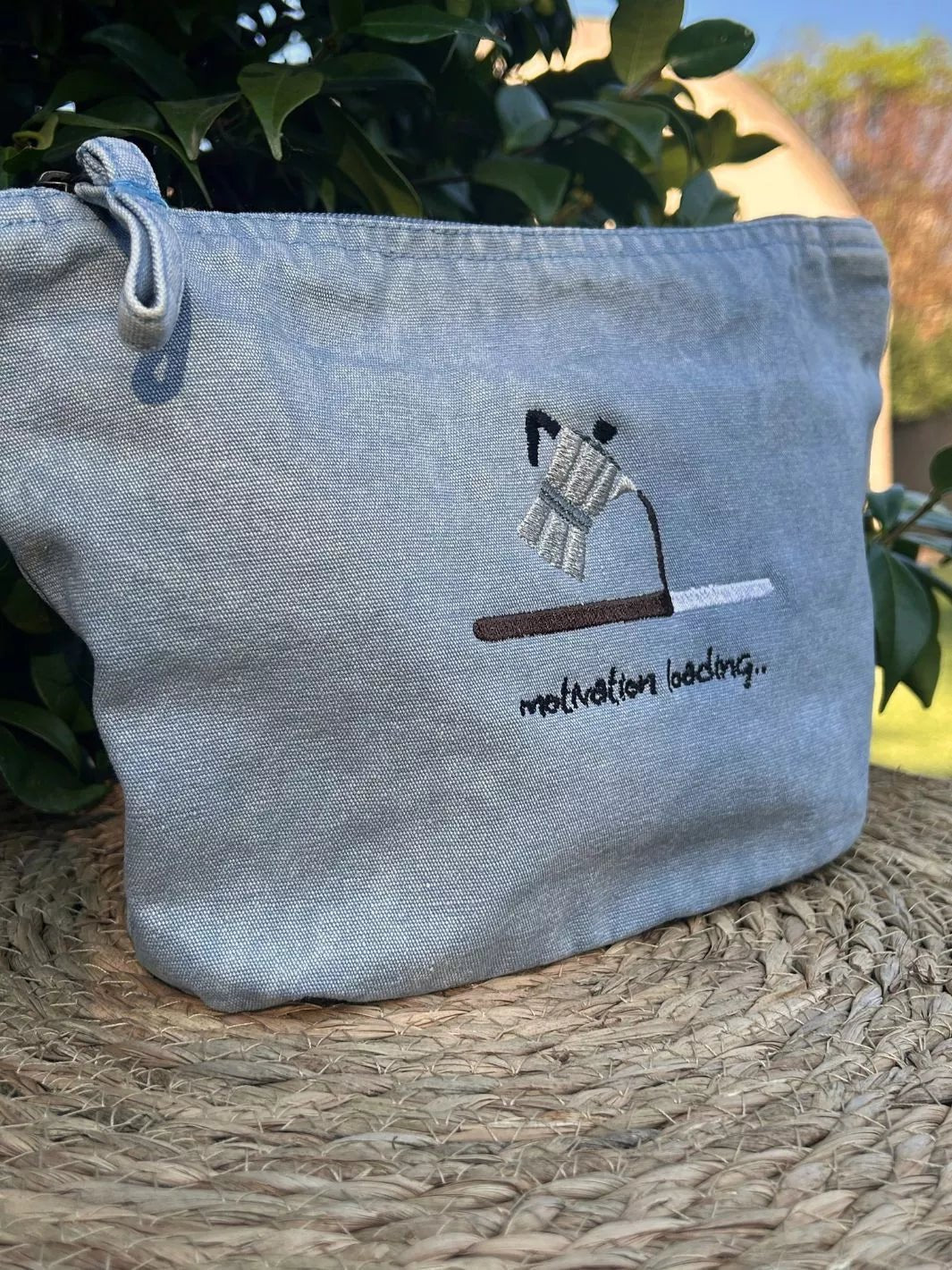 Motivation Loading recycled cotton pouch in washed sky