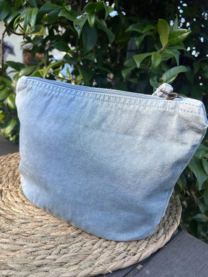 Motivation Loading recycled cotton pouch in washed sky
