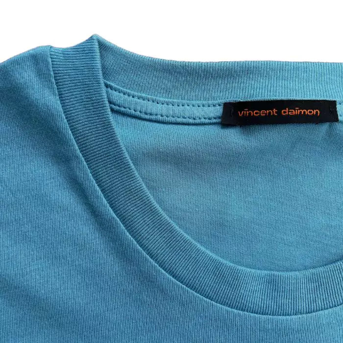Adriatic blue organic cotton t-shirt with logo embroidered on the sleeve