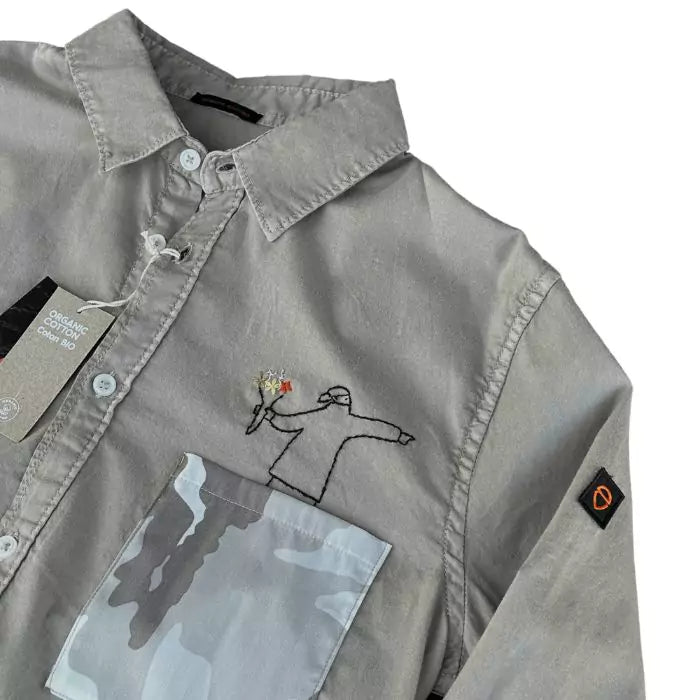 Organic cotton shirt with banksy embroidered above a military pocket