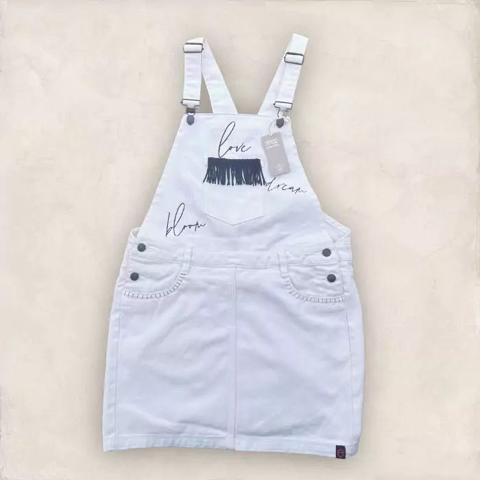 white skirt dungarees in organic cotton with embroidery and stitched fringes