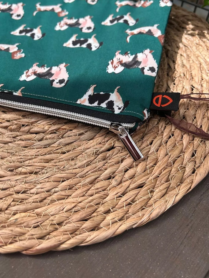 Lucky Paw handmade pouch with forest green dog print cotton fabric and tan Alcantara panel