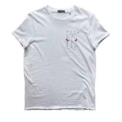 White organic cotton t-shirt with three "x" embroidered on the collar and golden hour print with glasses on the heart side