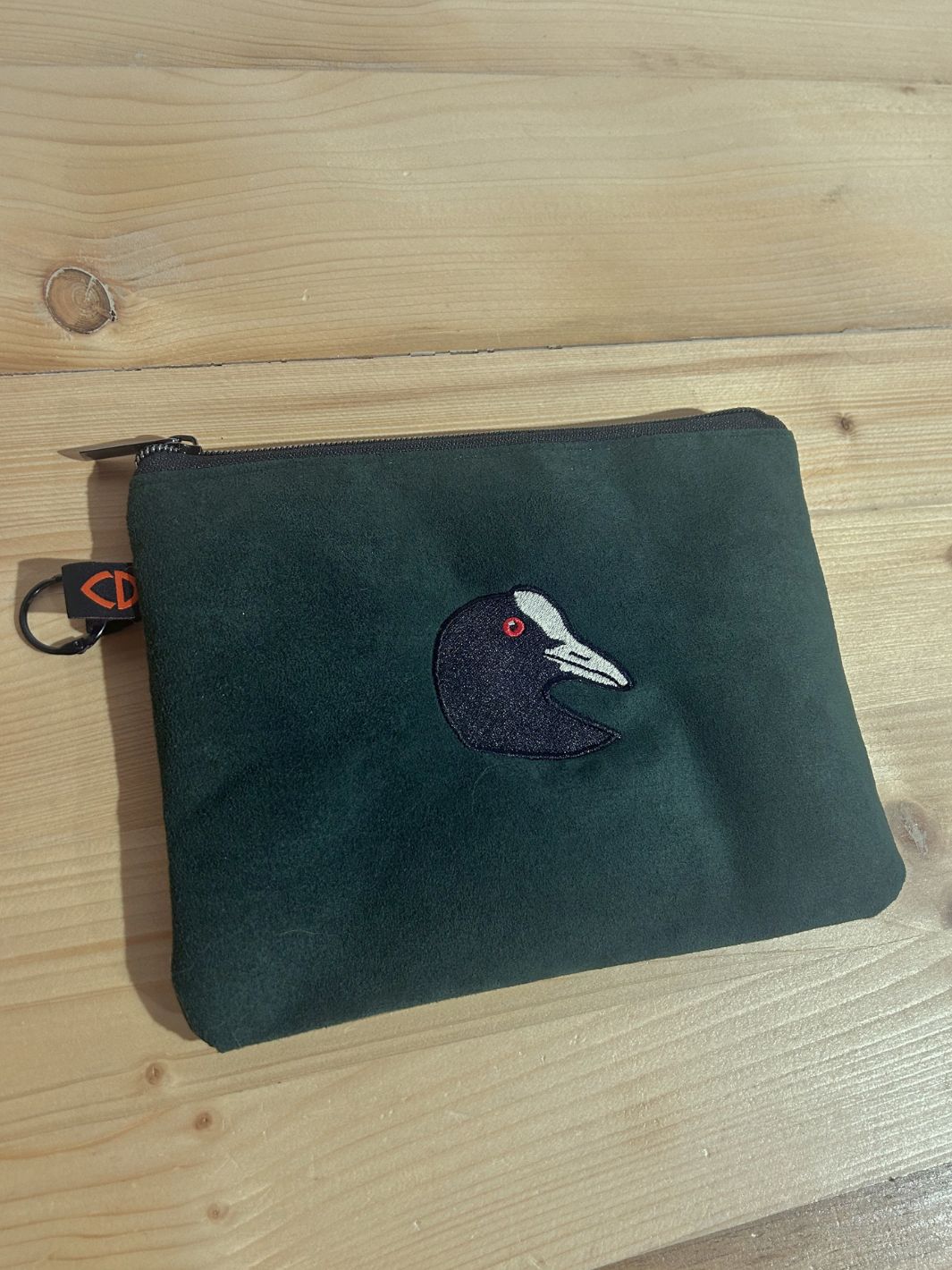 original pouches with embroidered black bird 
