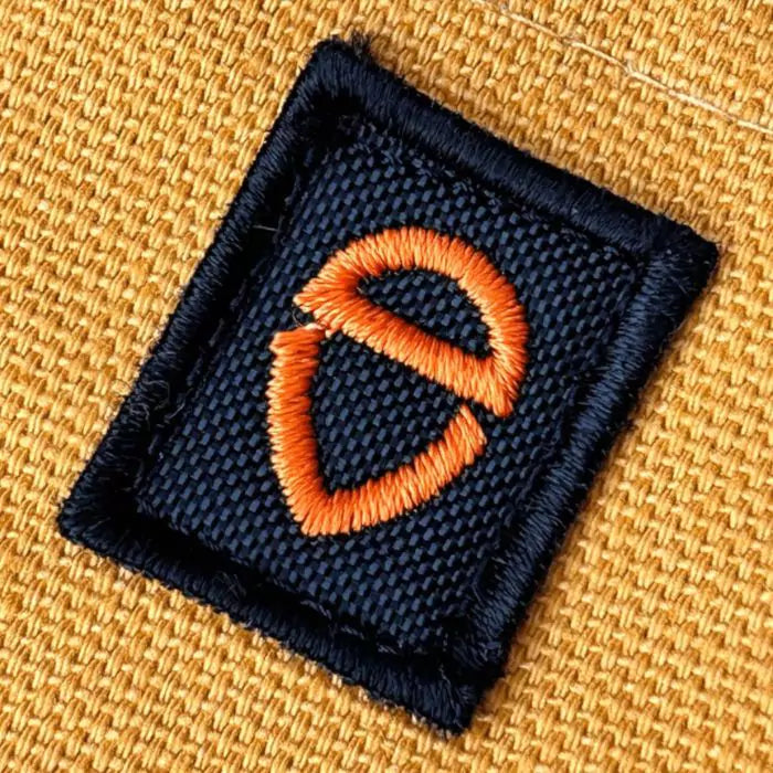 close up of vincent daimon embroidered logo