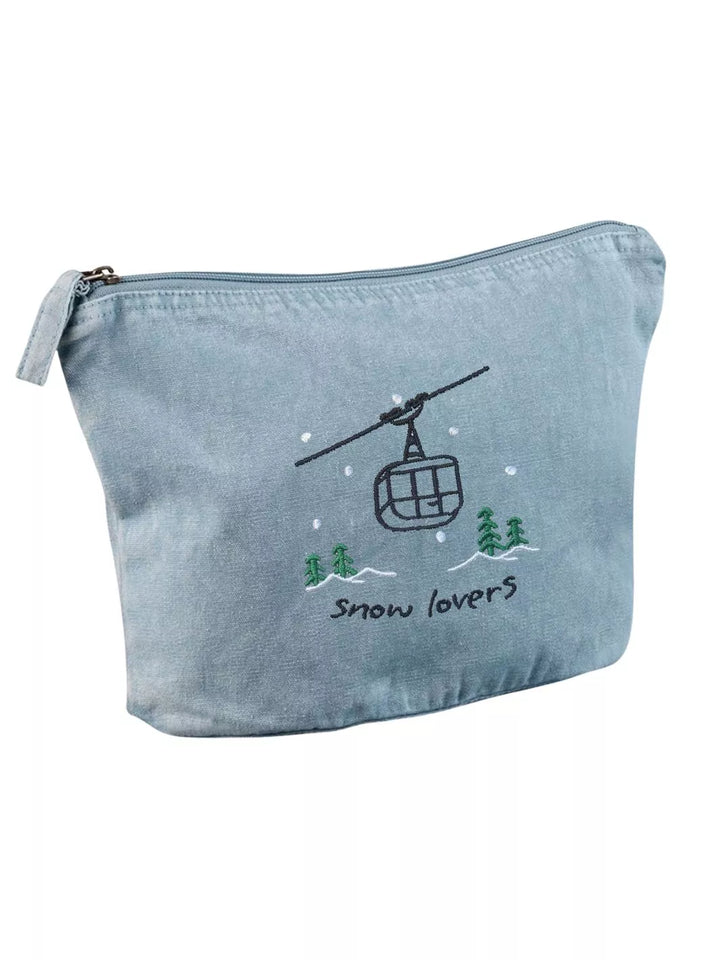 washed sky faded cotton travel pouch with embroidered cable car, pine trees, snow and Snow Lovers lettering