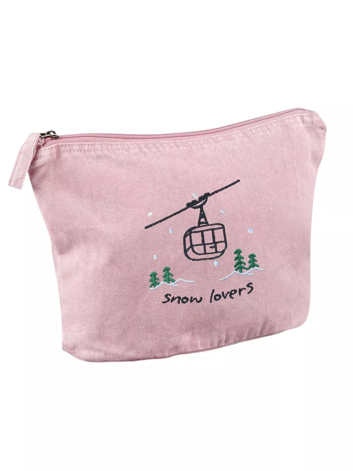 washed pink faded cotton travel pouch with embroidered cable car, pine trees, snow and Snow Lovers lettering