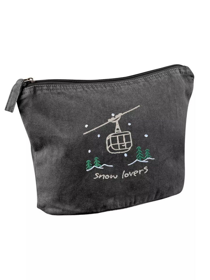 washed black faded cotton travel pouch with embroidered cable car, pine trees, snow and Snow Lovers lettering