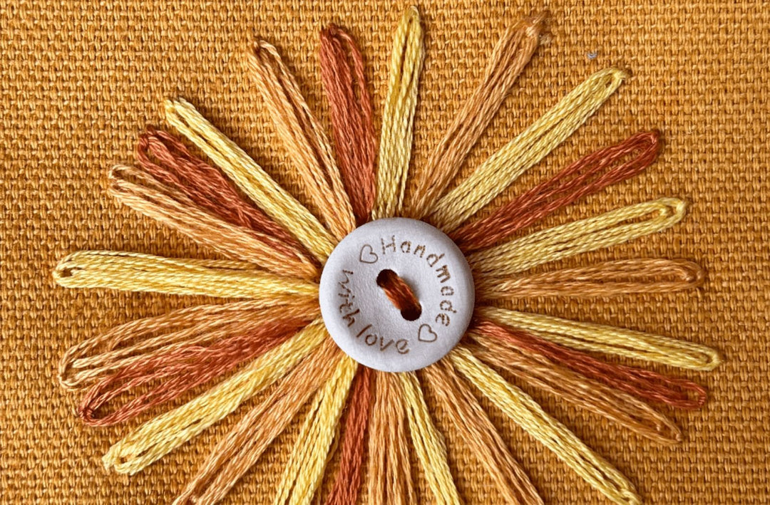 yellow sunflower embroidered with button on the middle