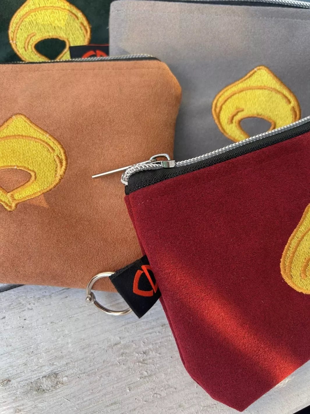 tortellino embroidered alcantara pouch