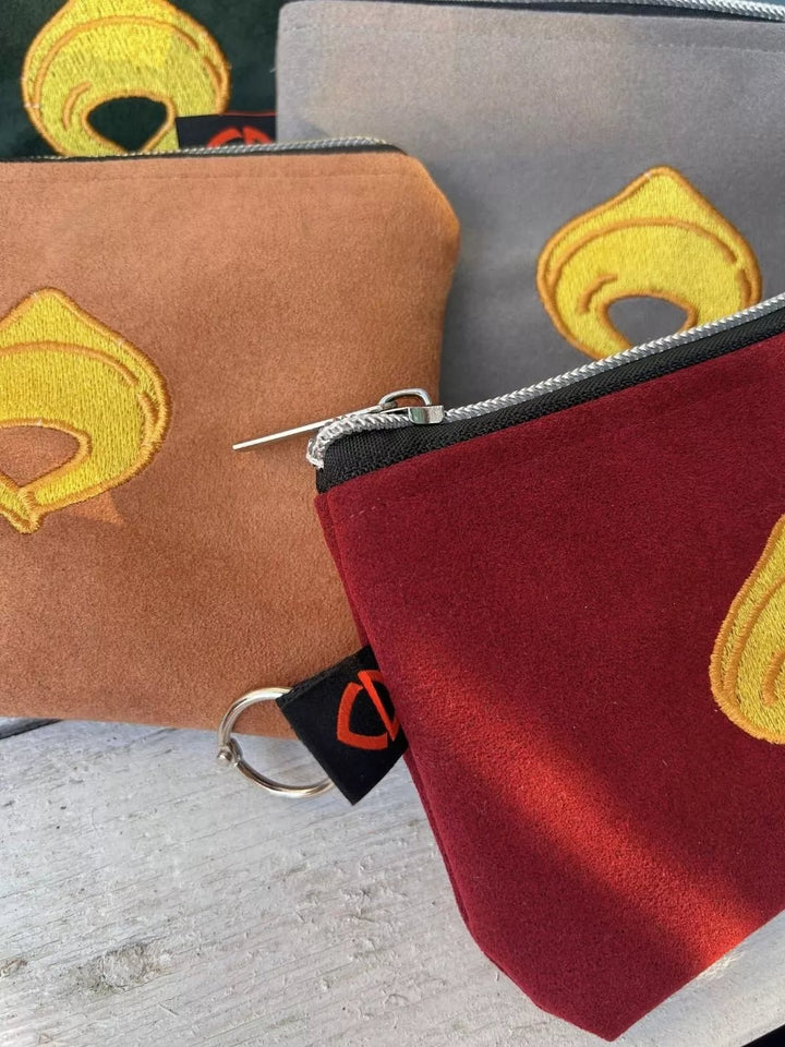 tortellino embroidered alcantara pouch