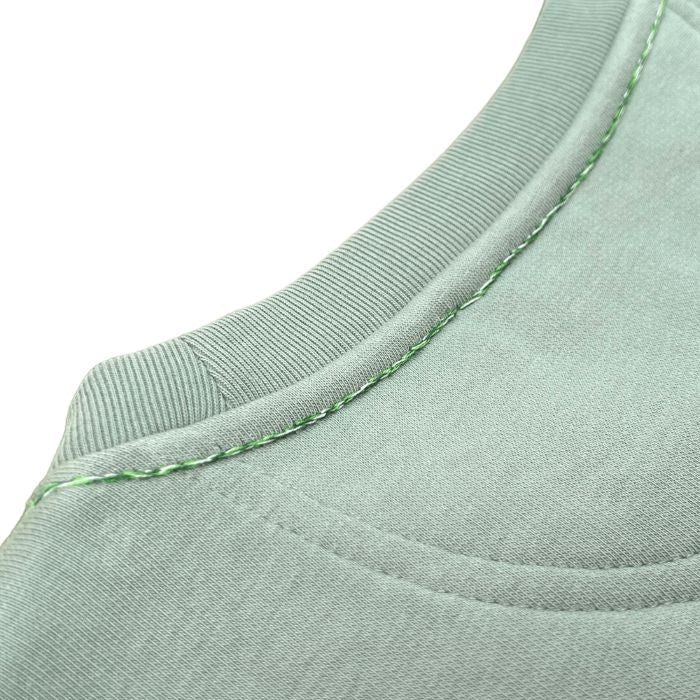 Eco-sustainable almond green sweatshirt with embroidery along the seams of the collar and right wrist