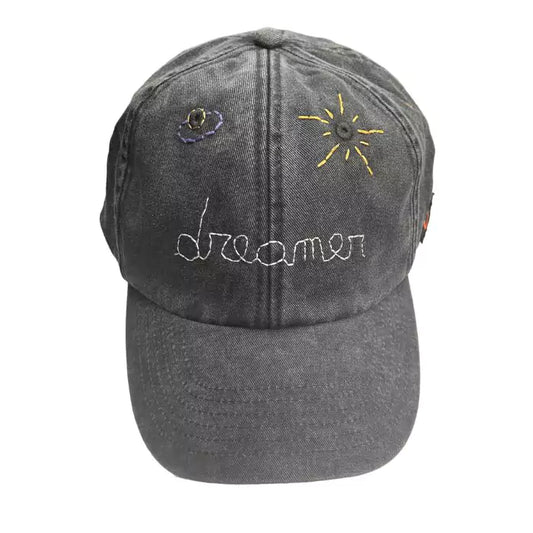 Washed black baseball cap with vintage effect embroidered with planets and "dreamer" inscription
