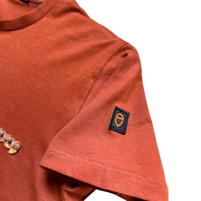 Terracotta boho tshirt with pocket created from sewn trimmings and sewn button