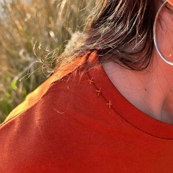 Terracotta boho tshirt with pocket created from sewn trimmings and sewn button