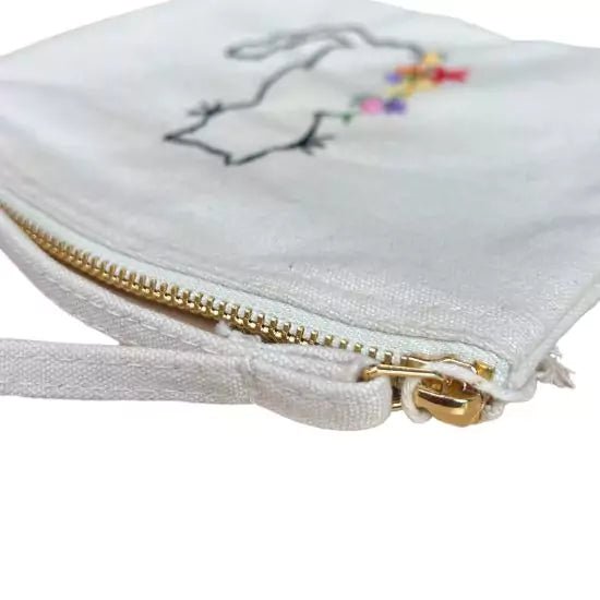 white organic cotton pochette with flowers and cat embroidered