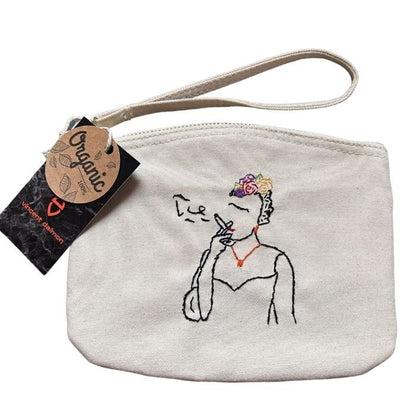White clutch bag in organic cotton with hand-embroidered Frida Kahlo smoking