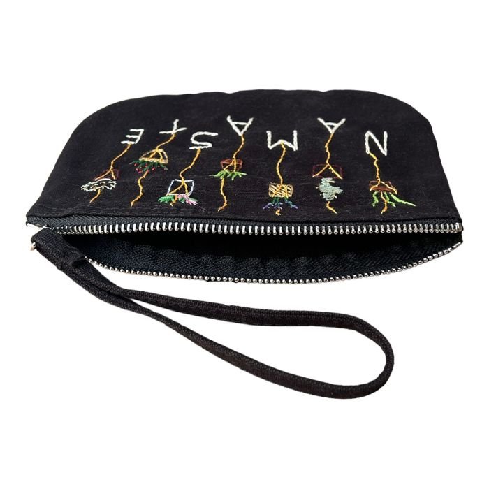 black hand-embroidered namaste clutch bag made of 100% organic cotton