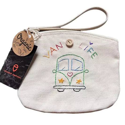 white clutch bag in organic cotton with a camper and the words "van life" embroidered on it