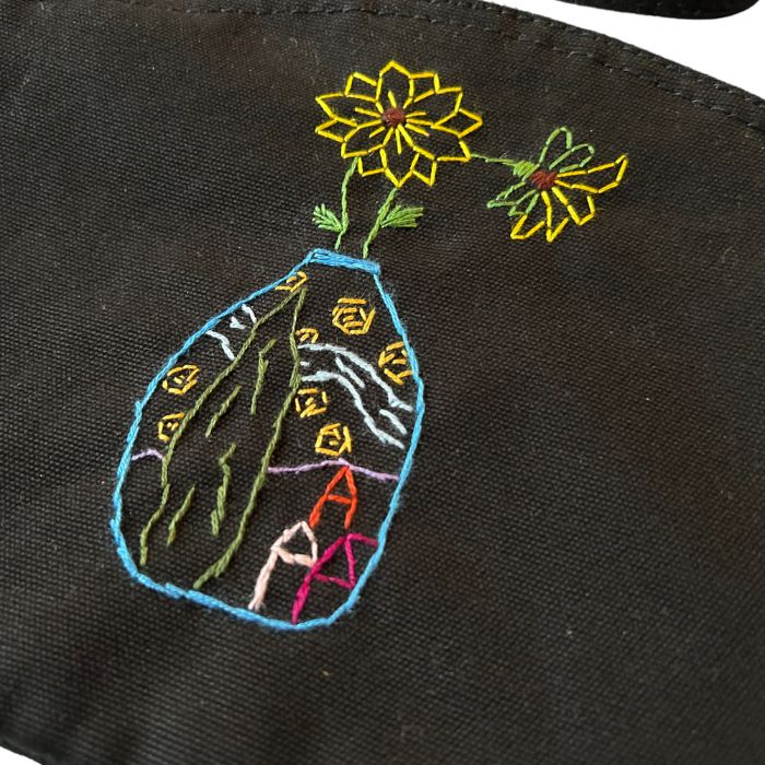 Black organic cotton clutch bag with hand-embroidered van Gogh's vase with sunflowers