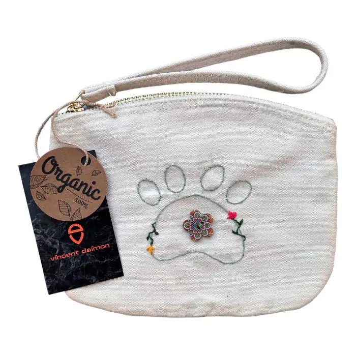 White organic cotton clutch bag embroidered with a dog paw adorned with flowers and a painted button