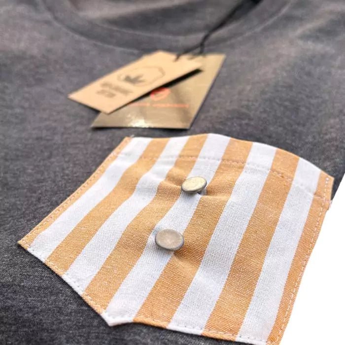 organic cotton t-shirt with yellow striped stitched pocket and matte buttons in the center