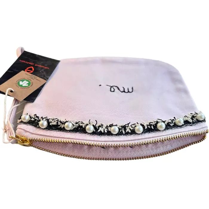 pastel pink organic cotton clutch bag with stitched trimmings and embroidered word