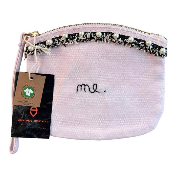 pastel pink organic cotton clutch bag with stitched trimmings and embroidered word