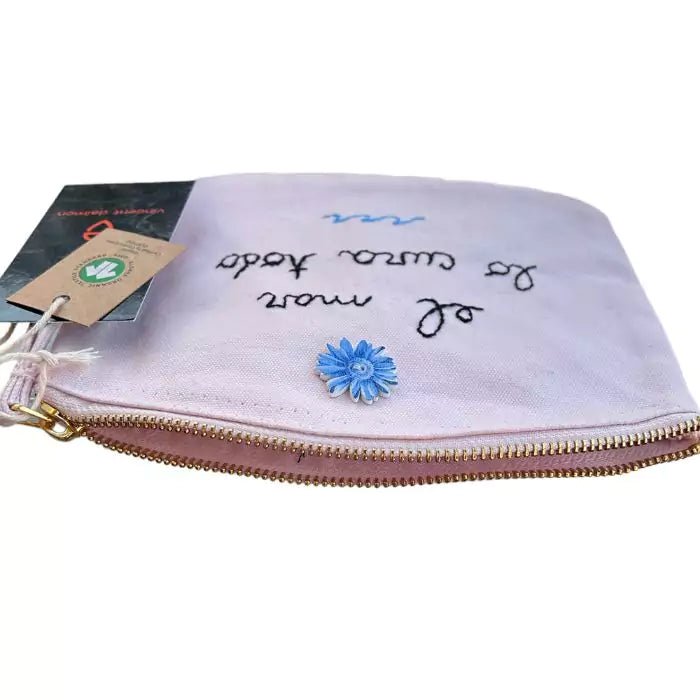 pink organic cotton clutch bag embroidered with the words "el mar lo cura todo"