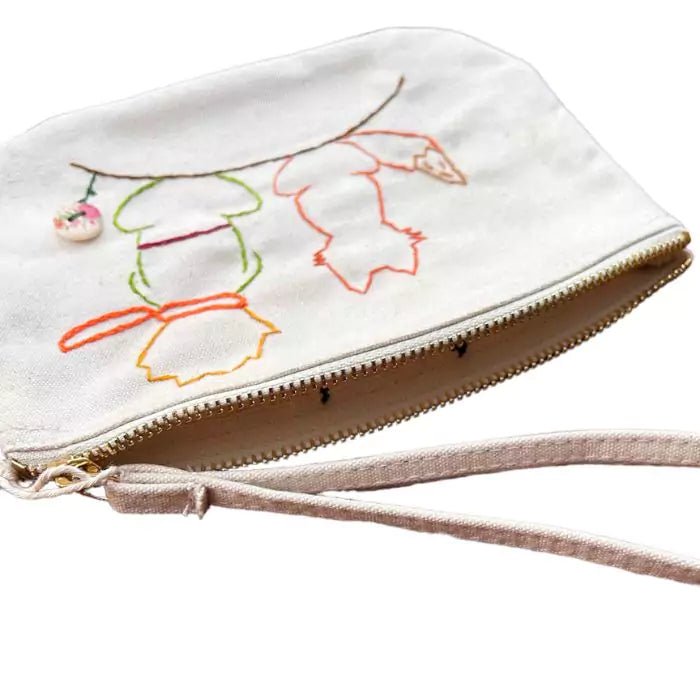 white organic cottone pochette with a little prince embroidered