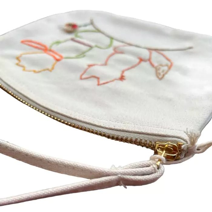 white organic cottone pochette with a little prince embroidered